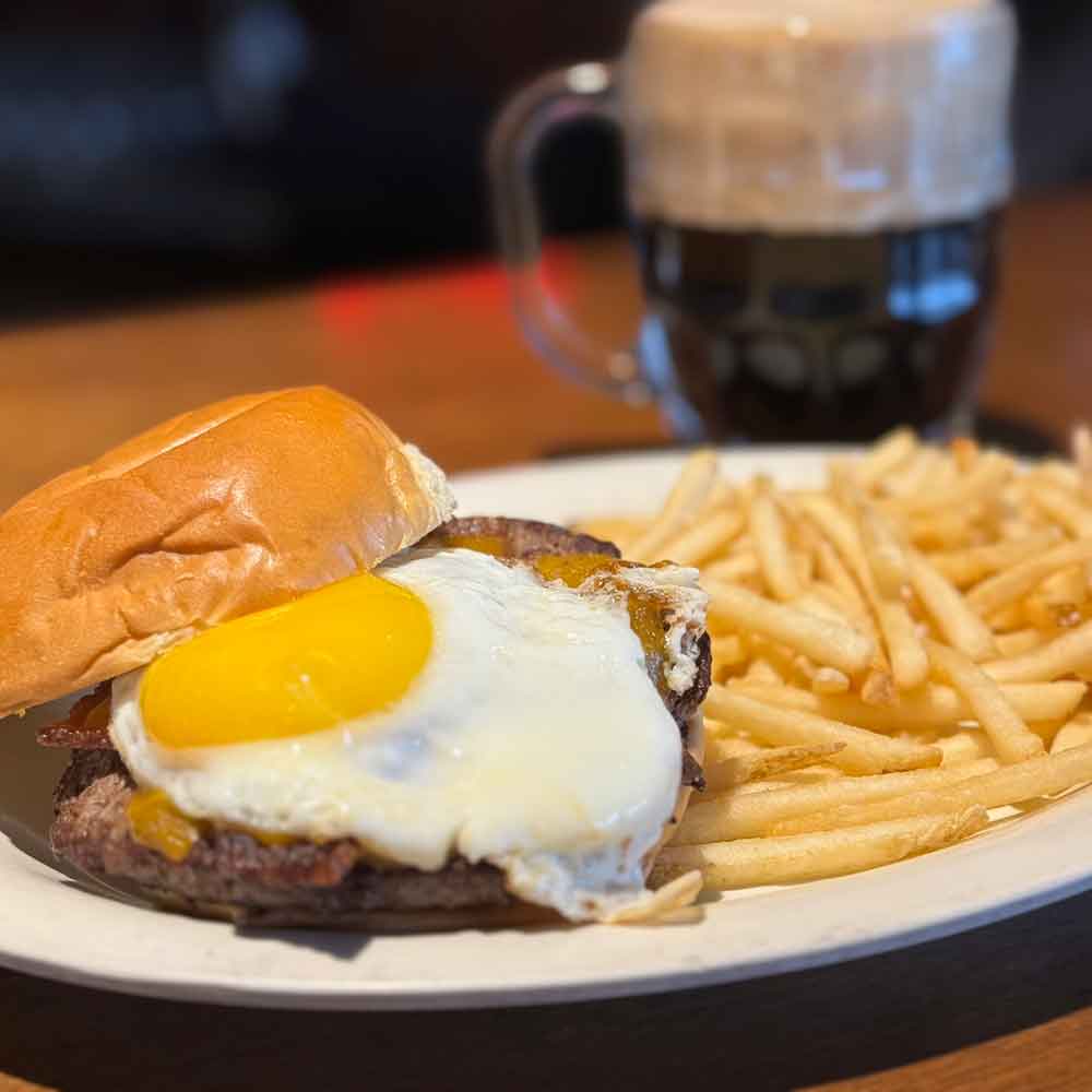 The cyclops burger features a fried egg on top of the burger.