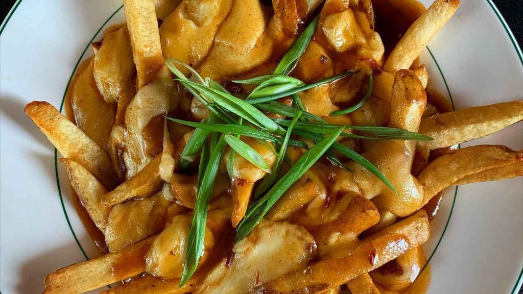 Poutine fries with gravy and white cheddar curds.